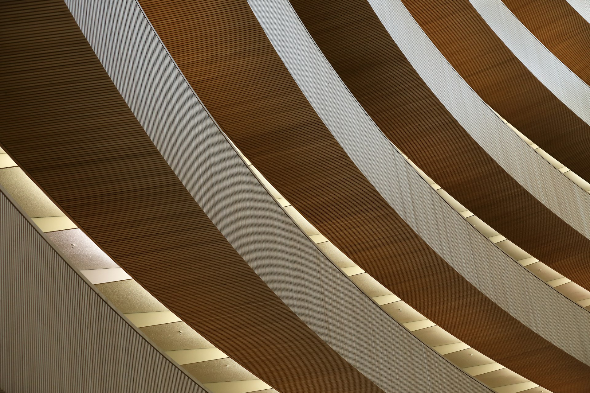 a curved wooden wall with a clock on it